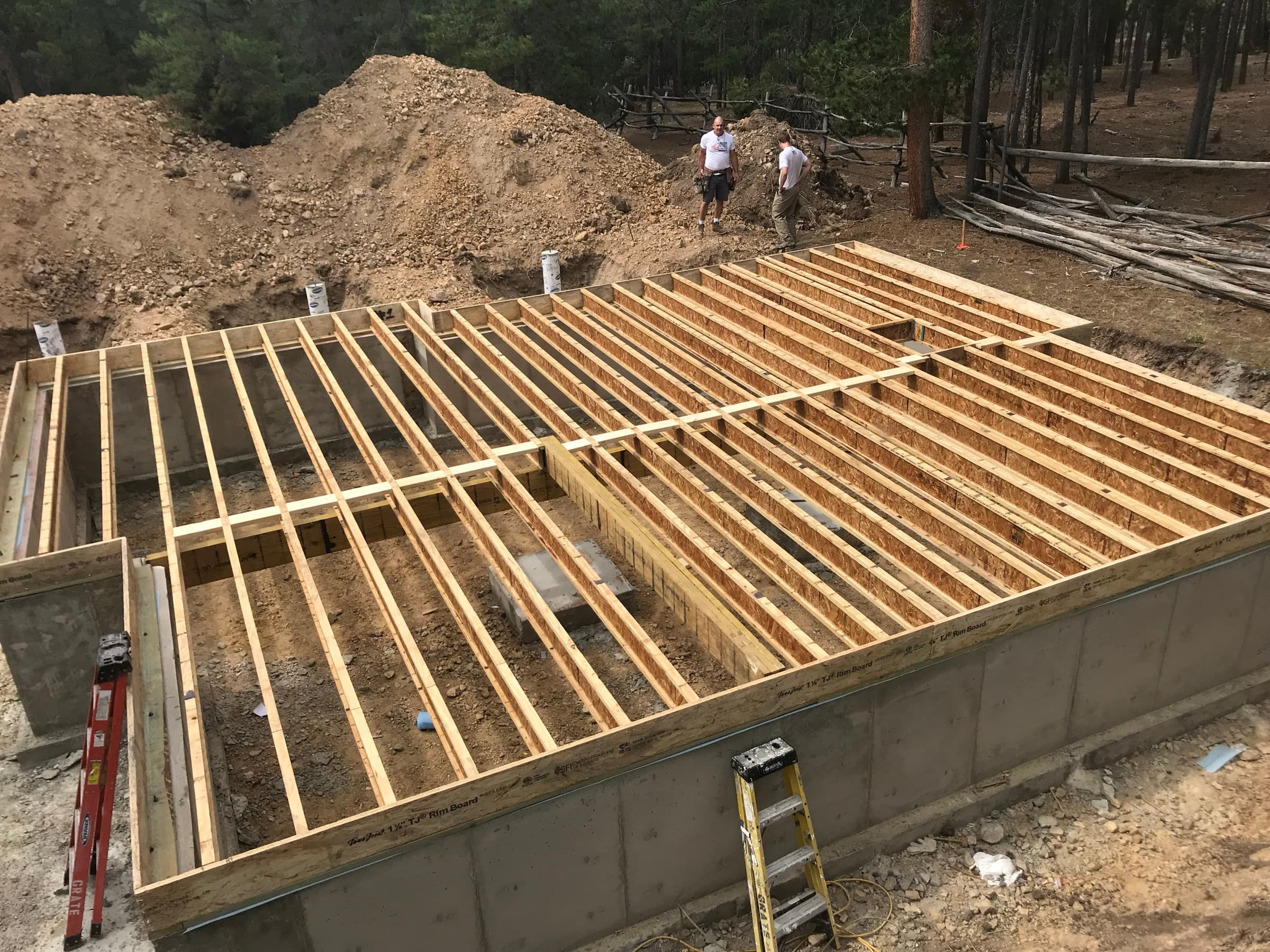 Cabin under construction on the wooded lot