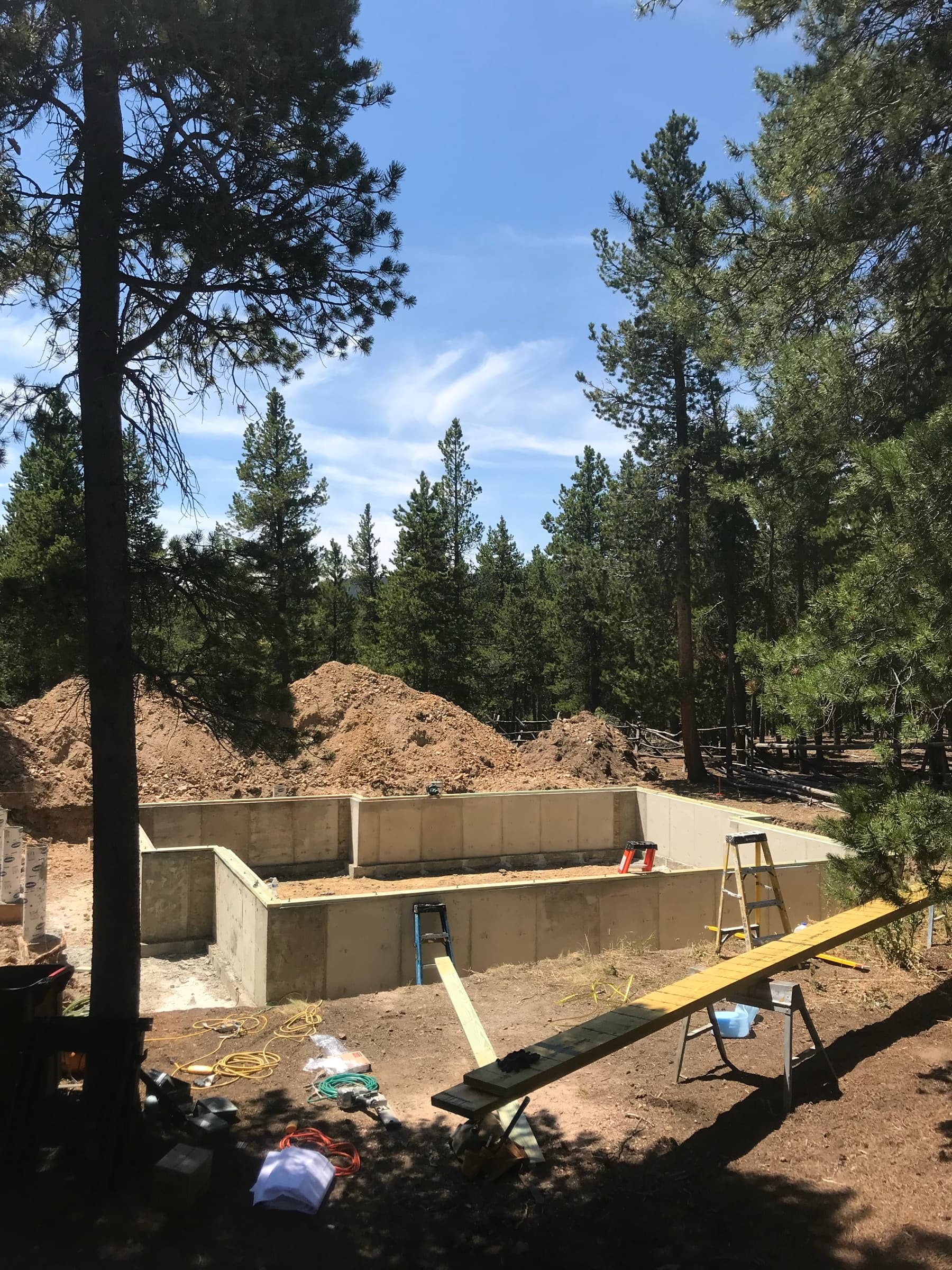 Concrete foundation poured on a wooded lot