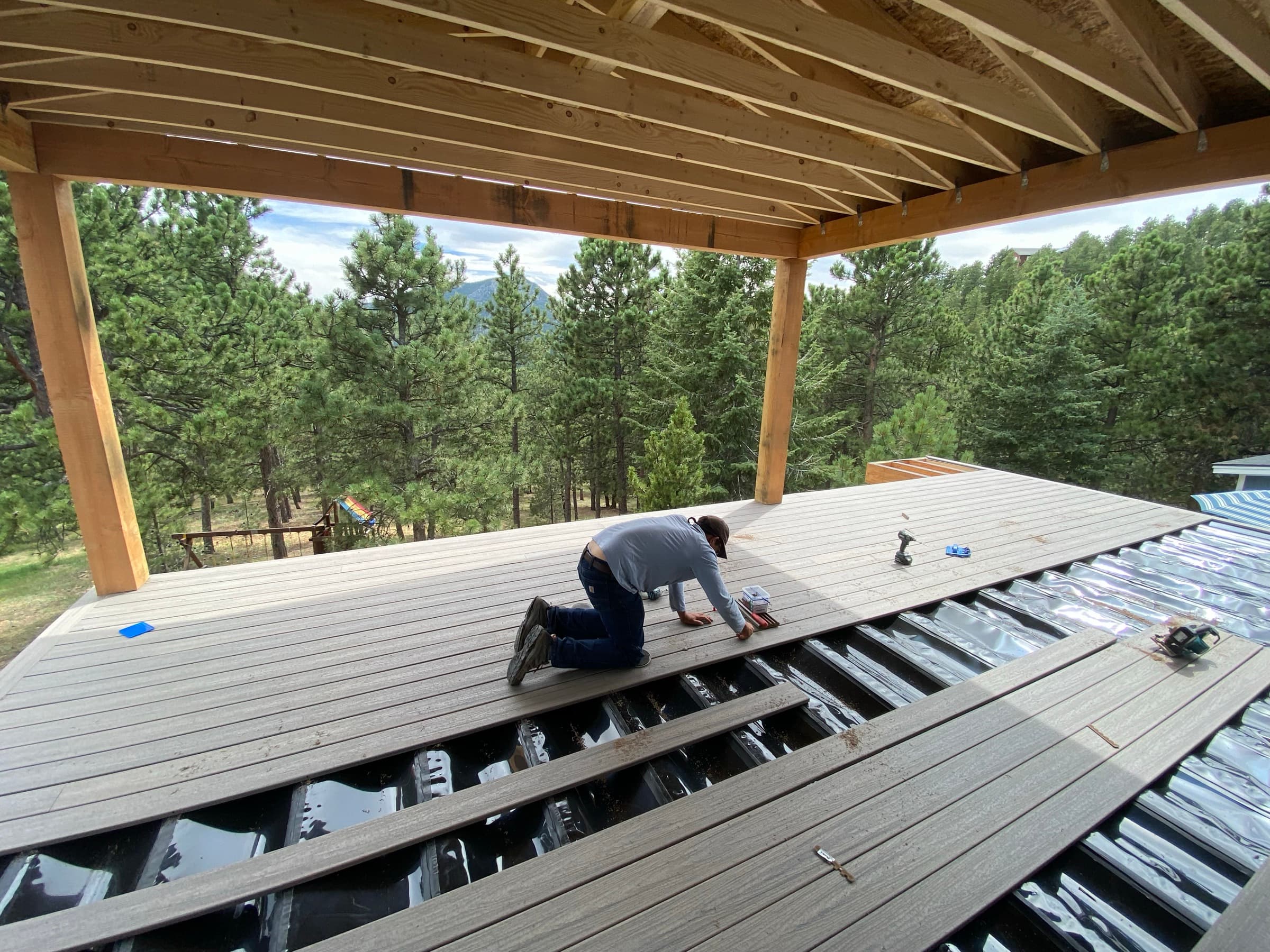 Installing composite decking on a timber-framed covered deck