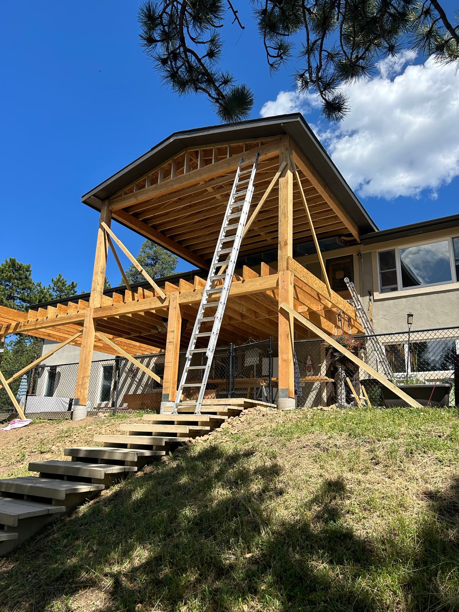 Side view of the two-story timber deck addition