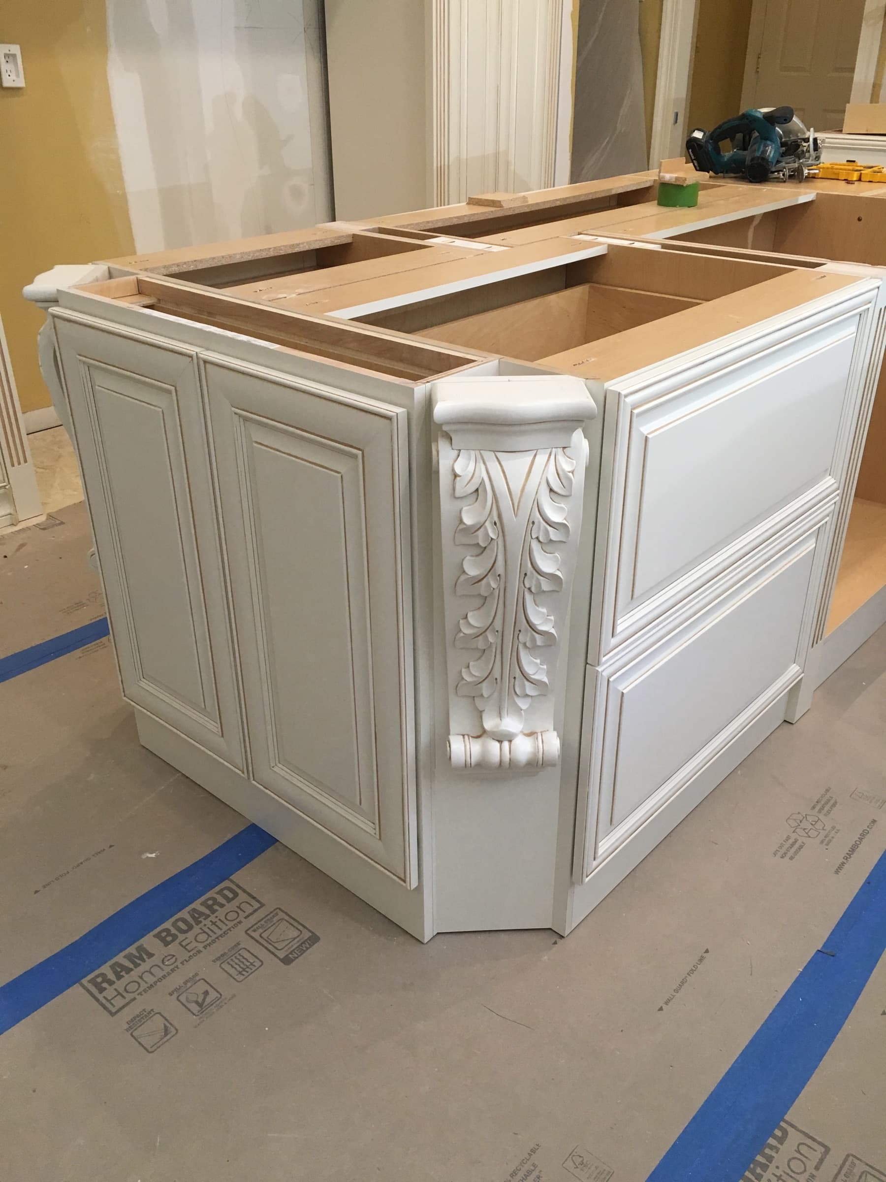 Carved corbel detail on the custom kitchen island
