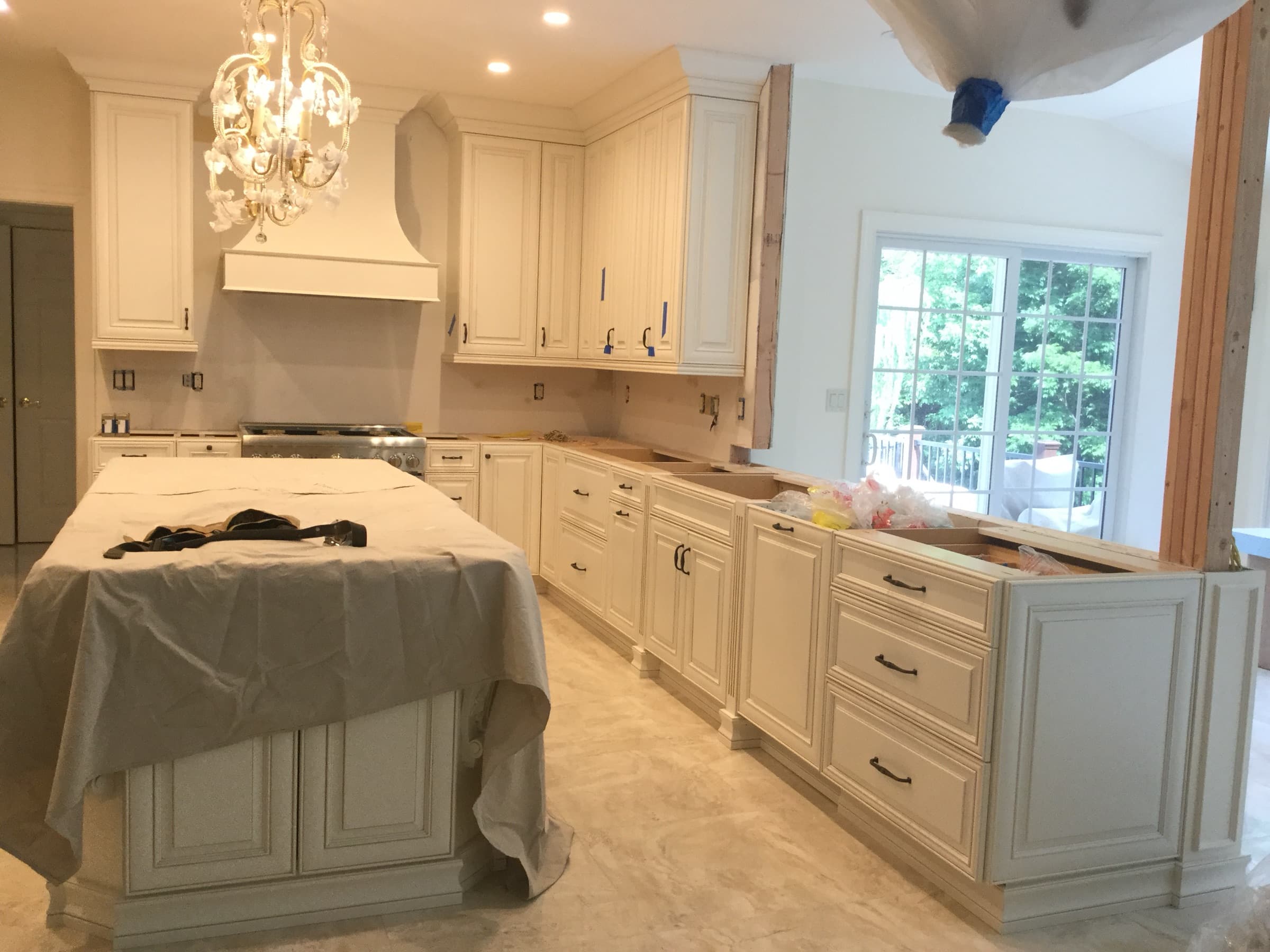 Range wall and white cabinetry during the kitchen remodel