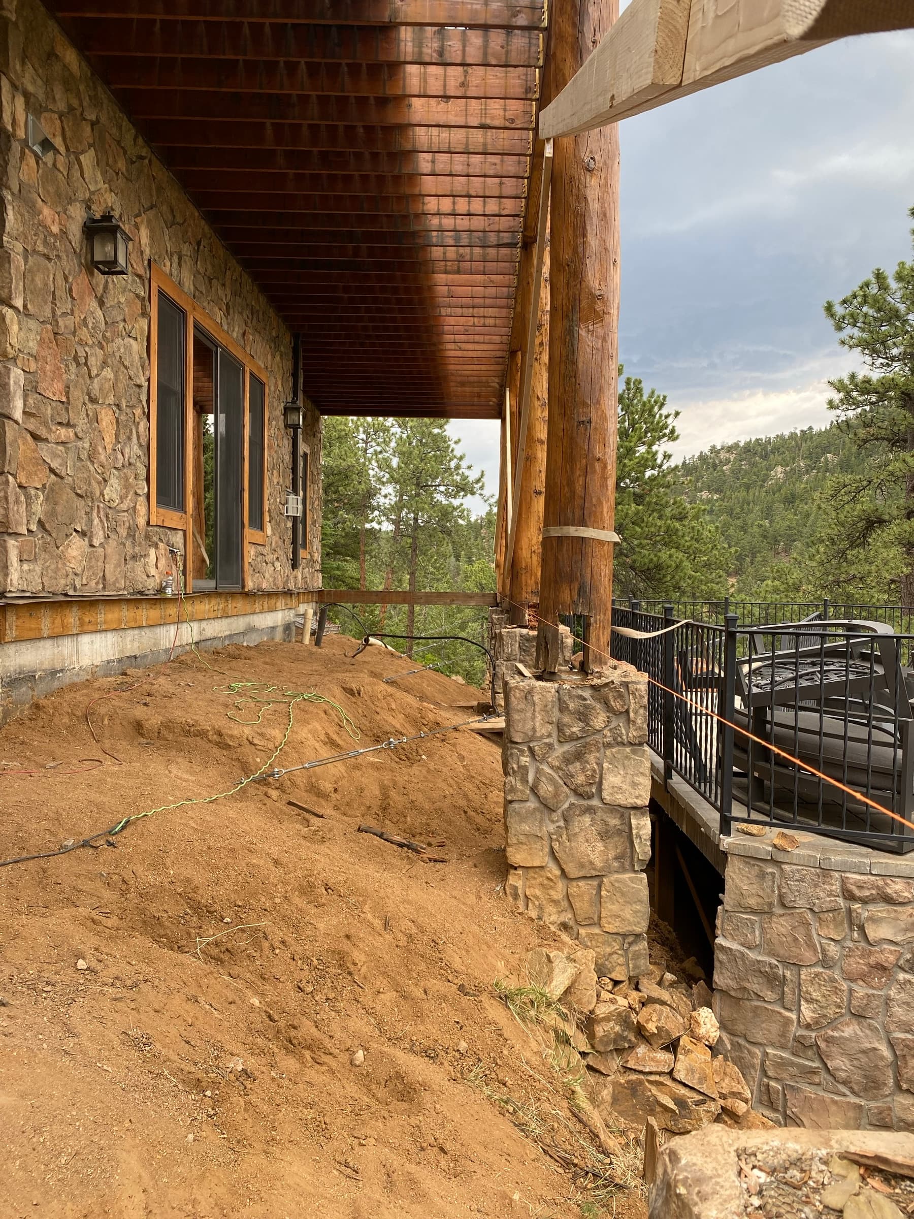 Structural work under the log-house porch