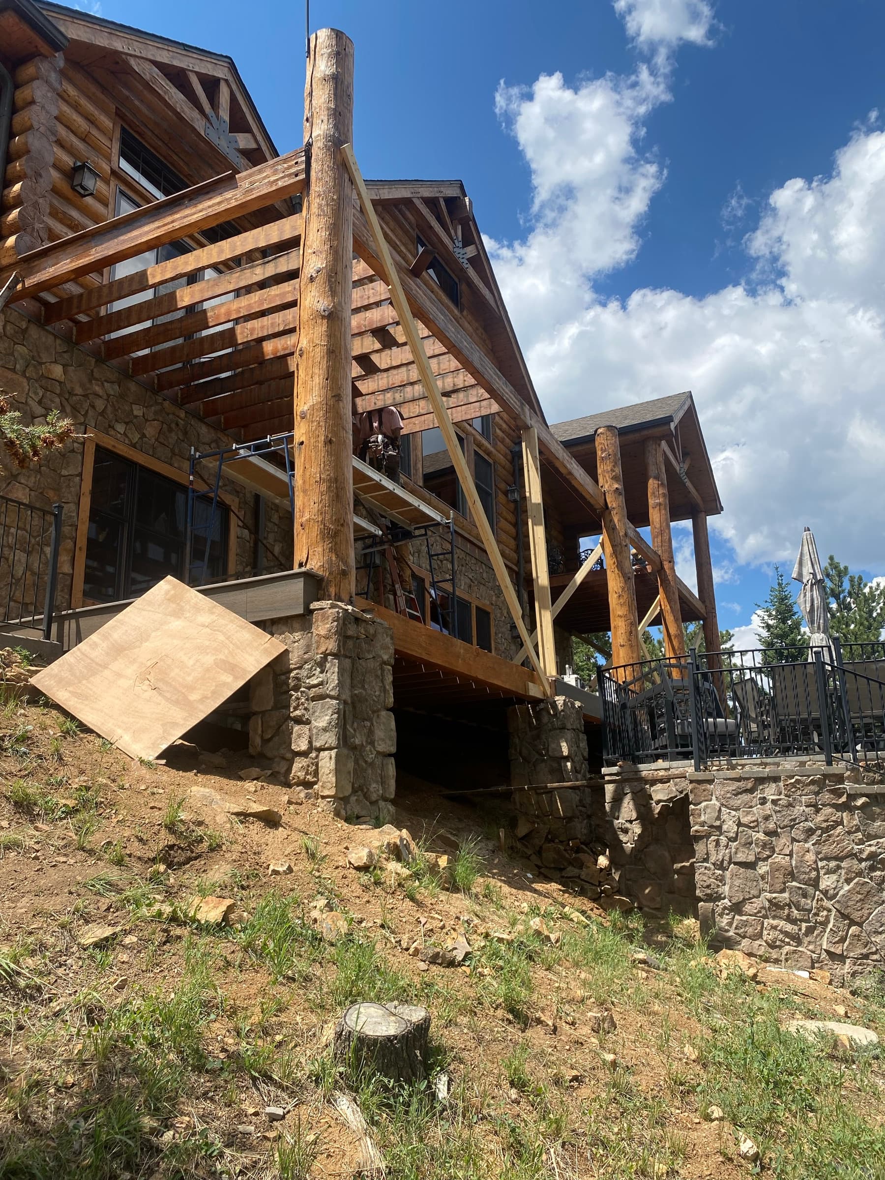 Deck rebuild on the log-and-stone house